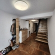 Flur mit Treppenaufgang - Design trifft Raum – Modernisiertes Domizil mit Einliegerwohnung