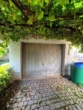 Garage - Geräumiges Zweifamilienhaus mit Gewerbe, vielen Stellplätzen und idyllischem Garten in Friedelhausen