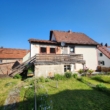 Rückansicht - Freistehendes Ein bis Zweifamilienhaus mit großem Garten und Garage – Sanierungsobjekt mit Potenzial
