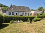 Seitenansicht mit Gartenbereich - Kernsaniertes Einfamilienhaus mit modernem Look und traumhaftem Garten in Weidenthal